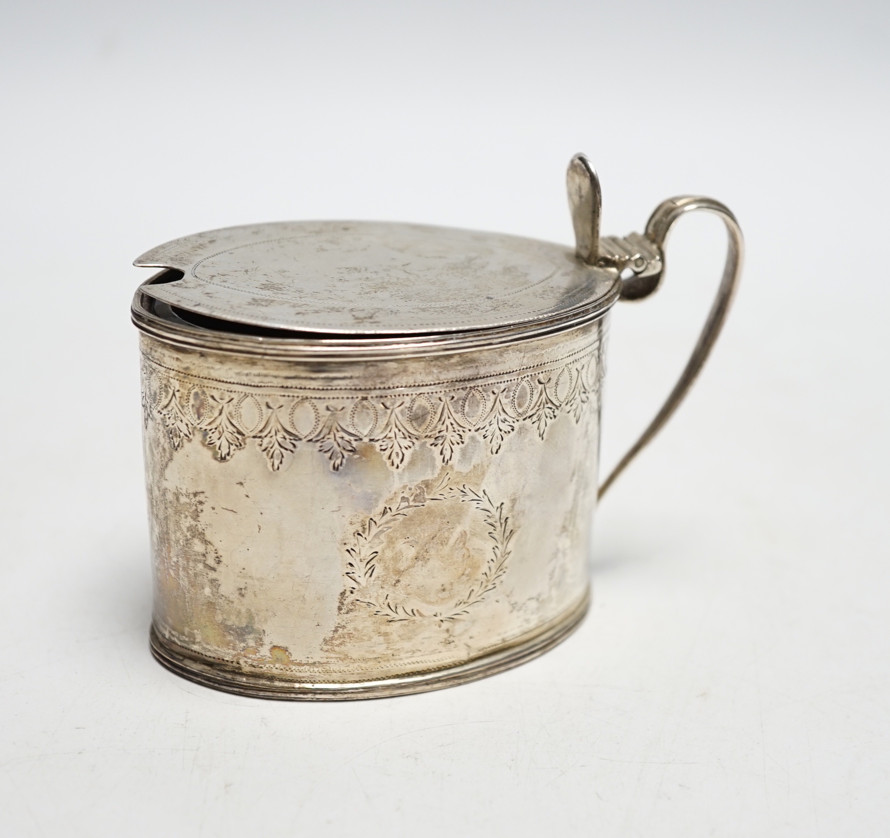 A George III silver oval mustard pot, John Gold, London, 1798, length 77mm.
